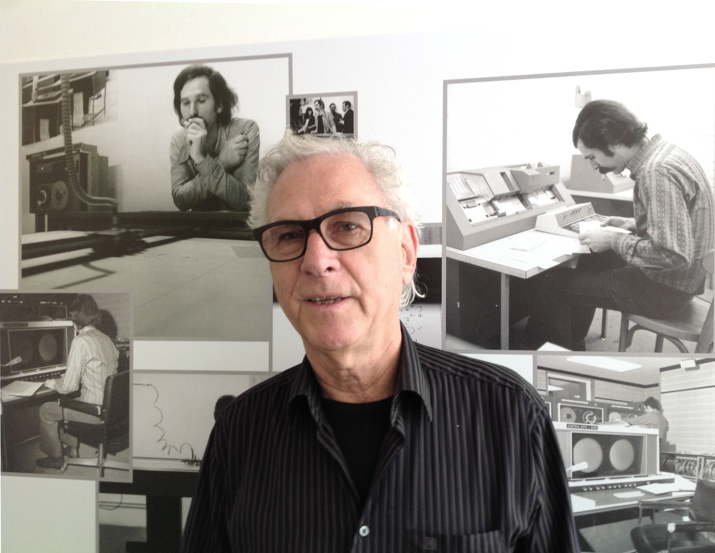 Portrait of the artist Manfred Mohr. In the background black and white photos showing the artist in 1971.