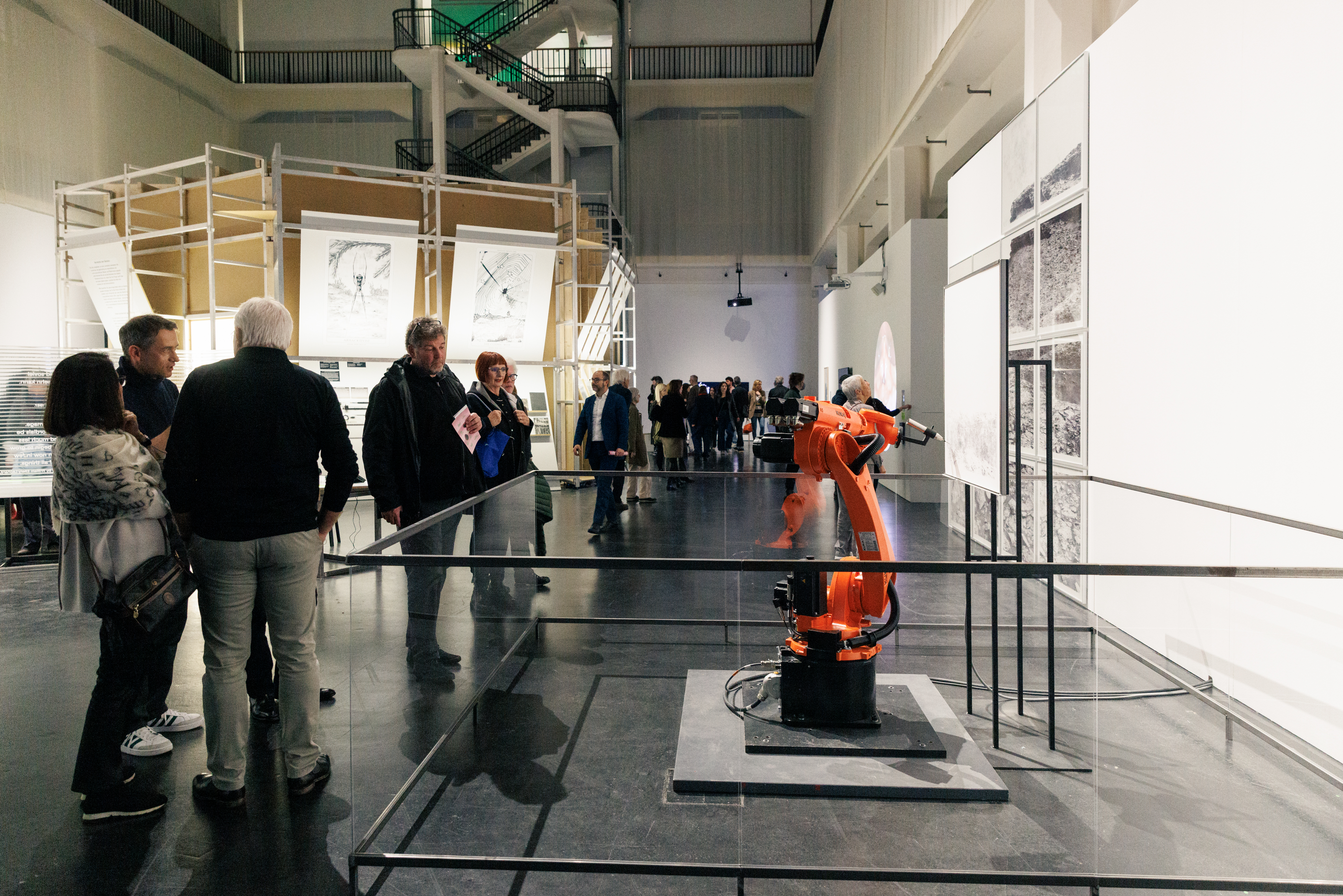 On display is an orange robot in the Renaissance 3.0 exhibition space.