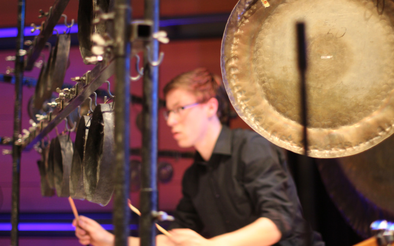 A young man playing drums