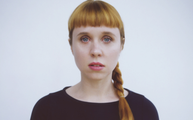 Portrait of a woman with long, braided hair