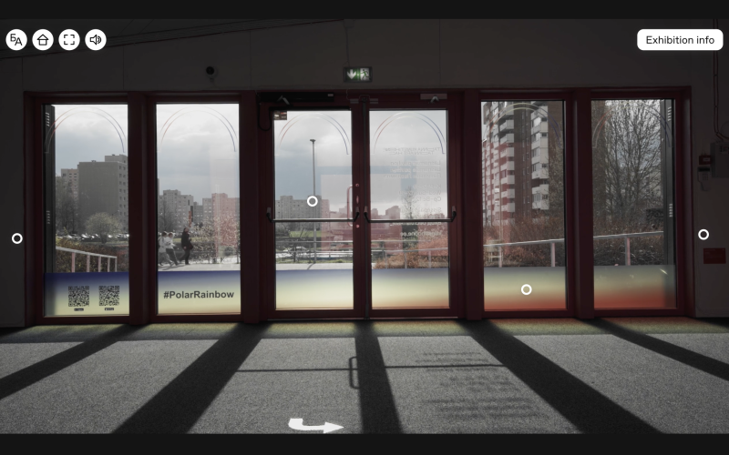 The skyline of a city seen through a glass front