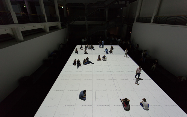 People standing on a white projection