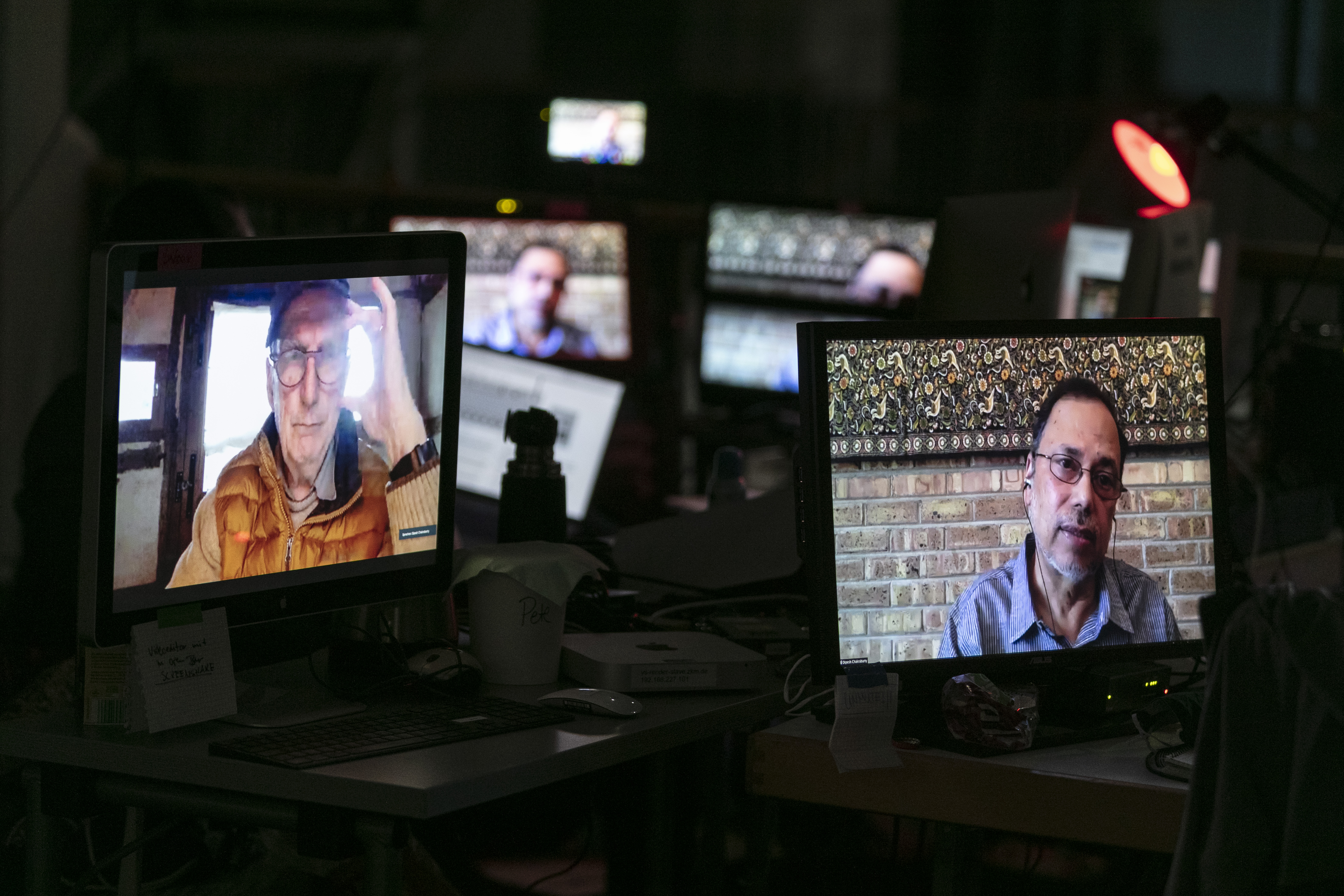 Multiple Mini-Displays show the faces of Bruno Latour and Dipesh Chakrabarty.