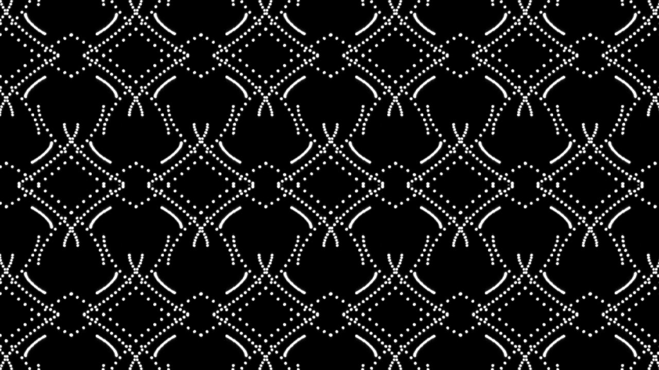 An arrangement of white dots as a graphic pattern on a black background