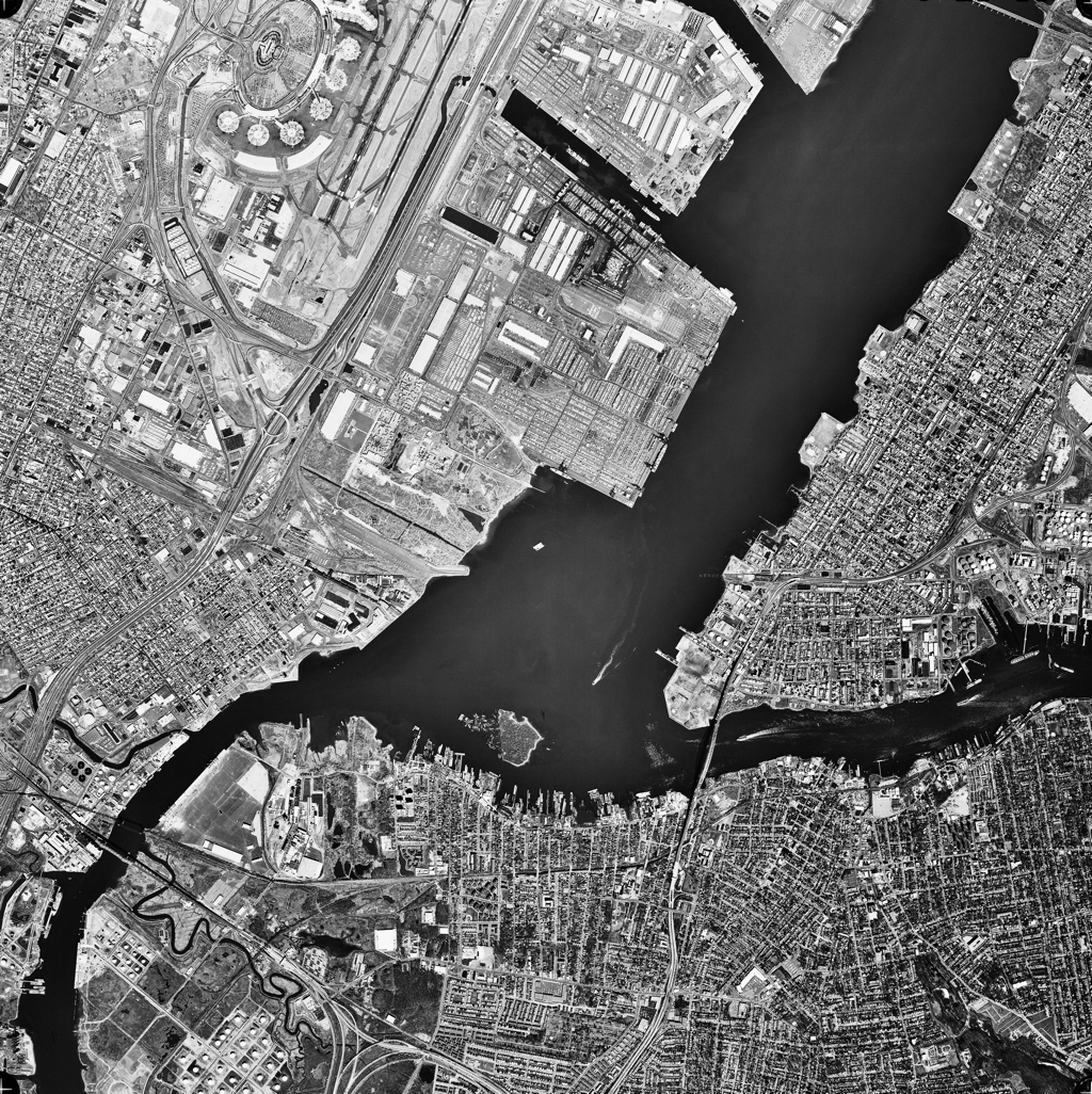 Jersey City from above. Houses and a river.