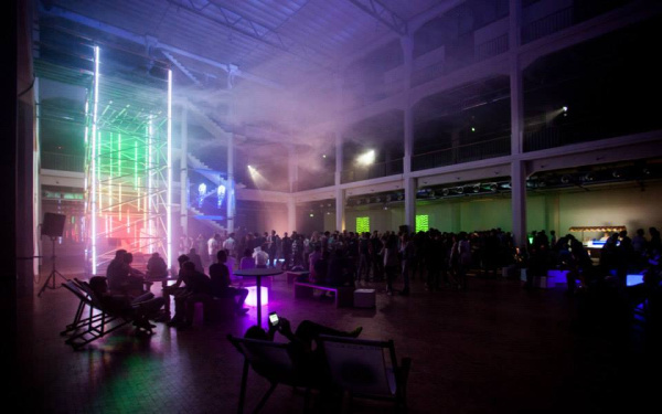 People dancing under a cloud in a closed room